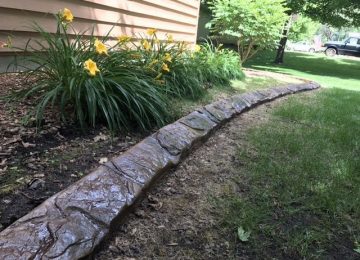 curbing on side of house bordering garden