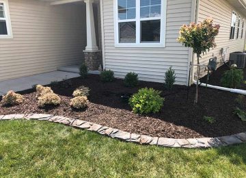 front of house with garden and curbing