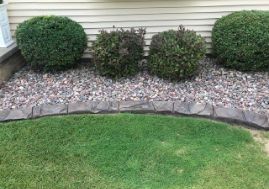 curbing on garden bed with bushes