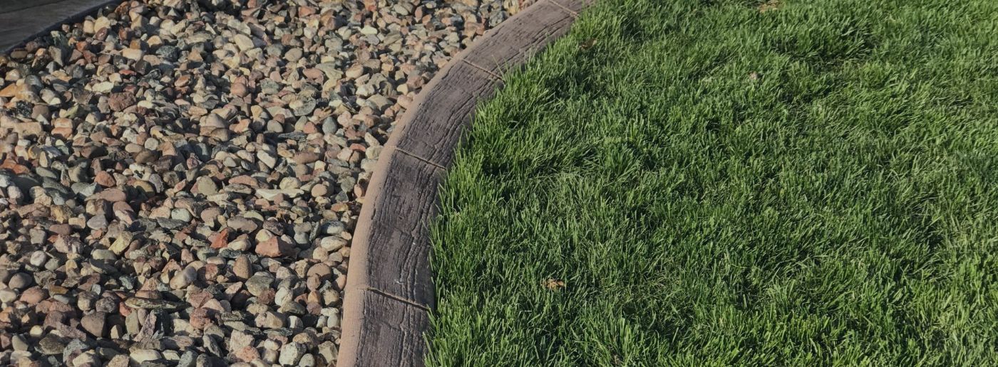 curbing bordering grass and garden bed